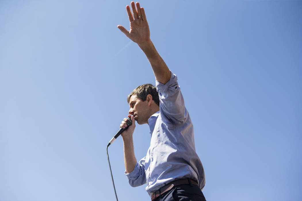 Democratic presidential candidate and former Texas congressman Beto O'Rourke acknowledges the crowd after arriving at a campaign stop at Pour Coffeehouse in Las Vegas on Sunday, March 24, 2019. (C ...