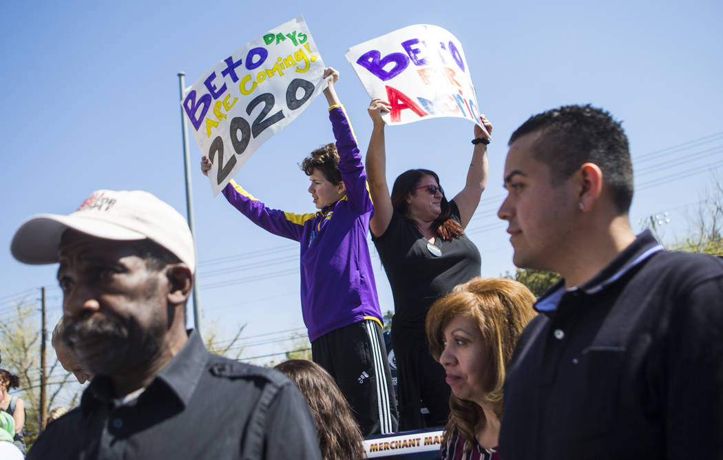 Gabriel Shimel, 11, left, and Angela Shimel hold up signs in support of Democratic presidential candidate and former Texas congressman Beto O'Rourke before he arrived for a campaign event at Pour ...