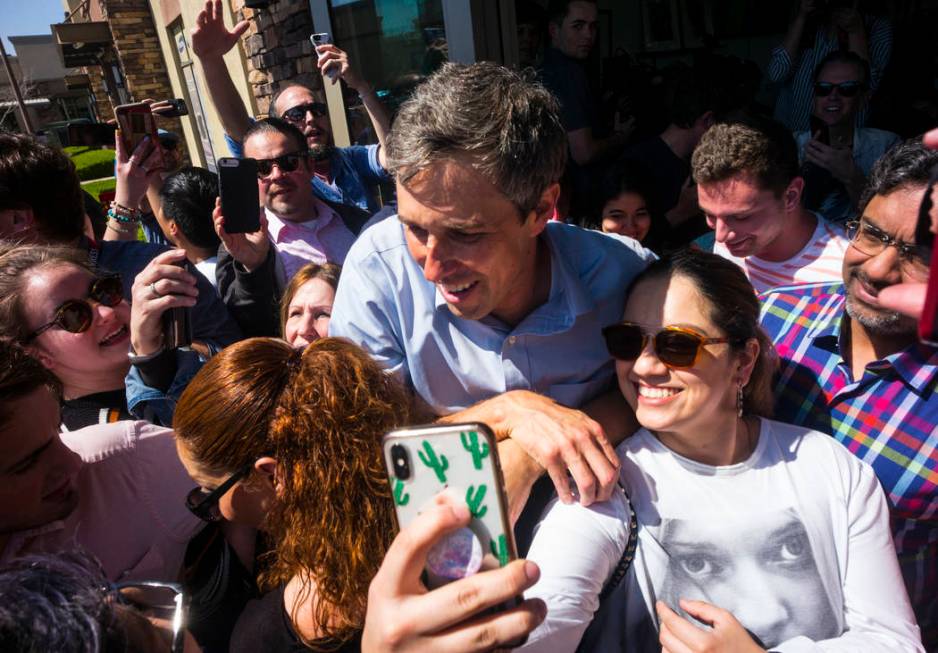 Democratic presidential candidate and former Texas congressman Beto O'Rourke takes pictures with supporters during a campaign stop at Pour Coffeehouse in Las Vegas on Sunday, March 24, 2019. (Chas ...