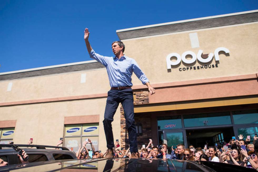 Democratic presidential candidate and former Texas congressman Beto O'Rourke acknowledges the crowd after arriving at a campaign stop at Pour Coffeehouse in Las Vegas on Sunday, March 24, 2019. (C ...