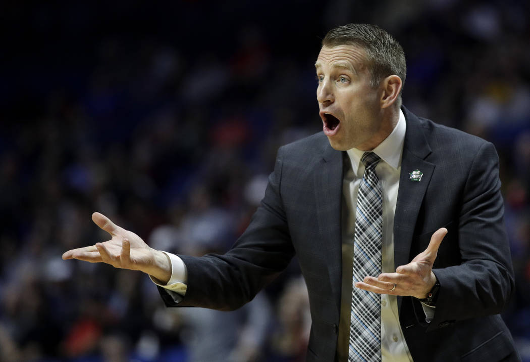 Buffalo head coach Nate Oats talks to his players during the first half of a first round men's college basketball game against Arizona State in the NCAA Tournament Friday, March 22, 2019, in Tulsa ...