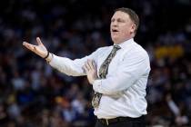 VCU coach Mike Rhoades talks with an official during the first half of a first-round game against Central Florida in the NCAA men's college basketball tournament Friday, March 22, 2019, in Columbi ...