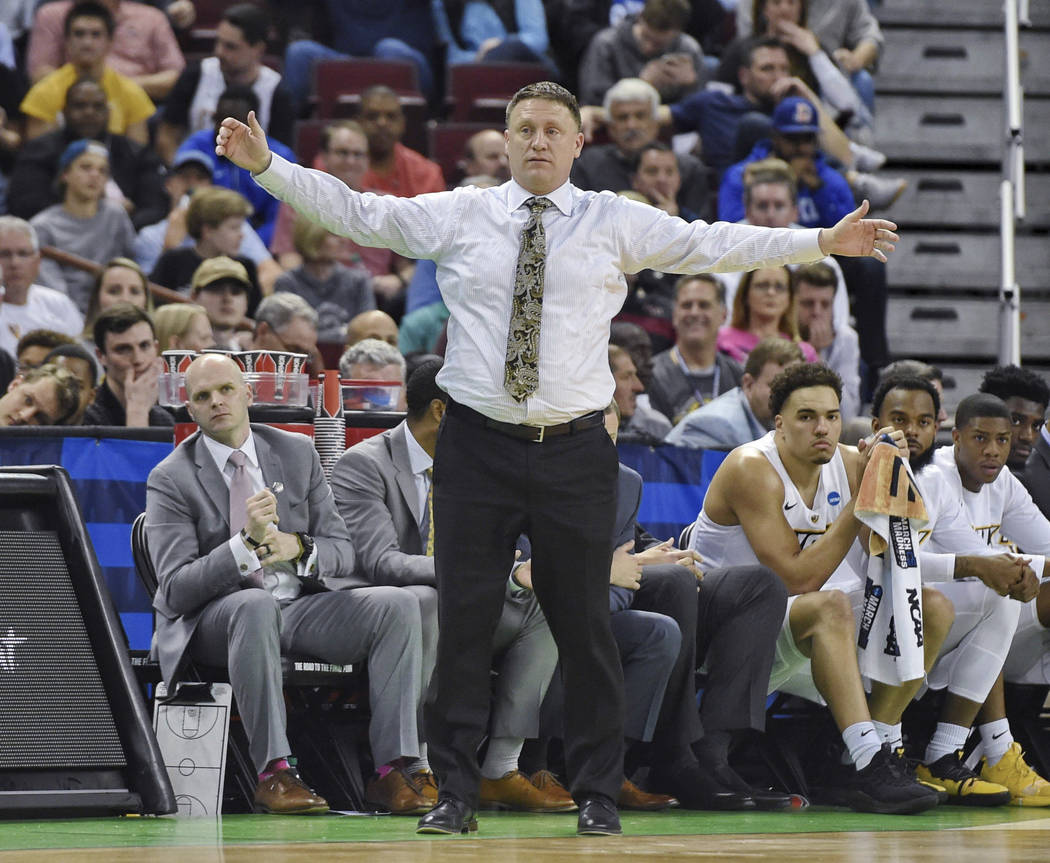 VCU coach Mike Rhoades watches during the first half of the team's game against Central Florida in the first round of the NCAA men’s college basketball tournament Friday, March 22, 2019, in ...