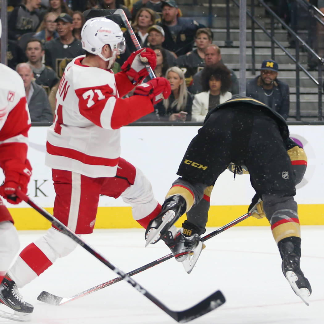 Vegas Golden Knights center Paul Stastny (26) is pushed by Detroit Red Wings center Dylan Larkin (71) during the first period of an NHL hockey game at T-Mobile Arena in Las Vegas, Saturday, March ...