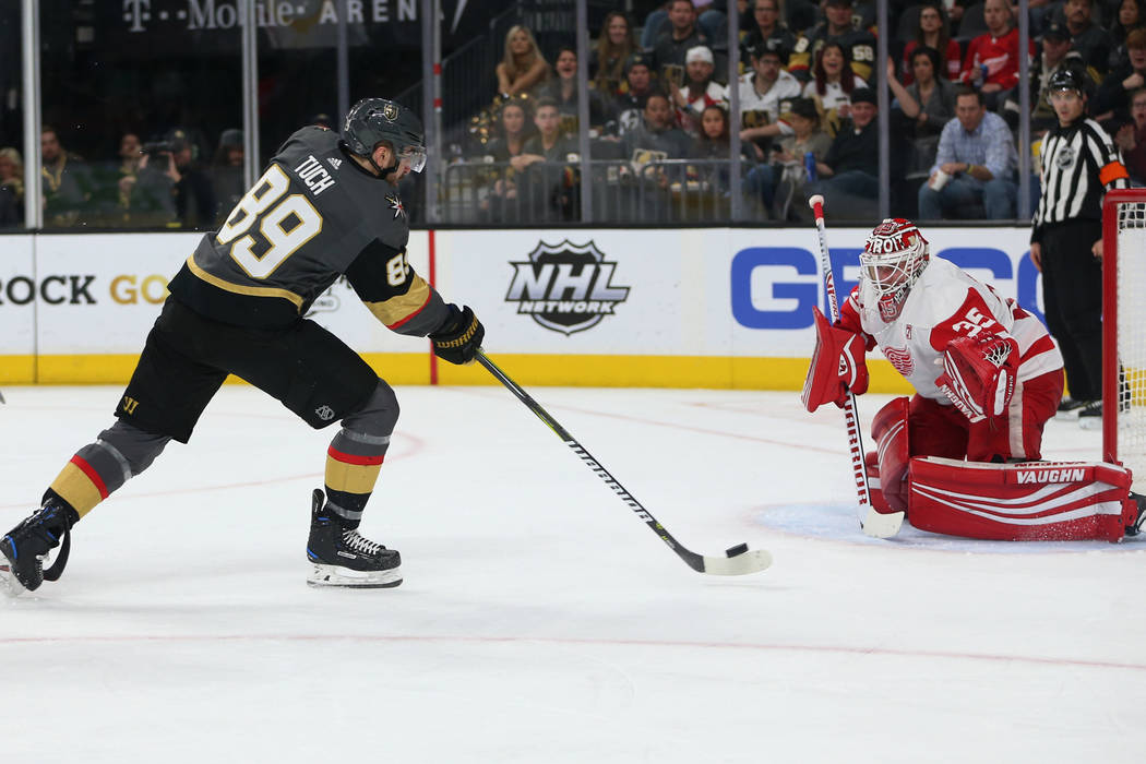 Vegas Golden Knights right wing Alex Tuch (89) takes a shot for a miss against Detroit Red Wings goaltender Jimmy Howard (35) during the second period of an NHL hockey game at T-Mobile Arena in La ...