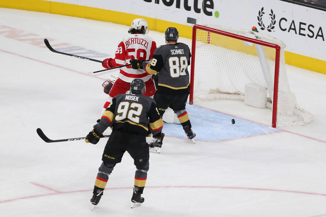 Vegas Golden Knights defenseman Nate Schmidt (88) and left wing Tomas Nosek (92), covering Detroit Red Wings left wing Tyler Bertuzzi (59), watch as the puck misses their goal during the third per ...