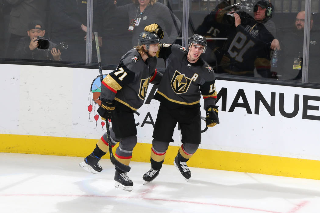 Vegas Golden Knights right wing Reilly Smith (19) celebrates his score with center William Karlsson (71) during the third period of an NHL hockey game at T-Mobile Arena in Las Vegas, Saturday, Mar ...