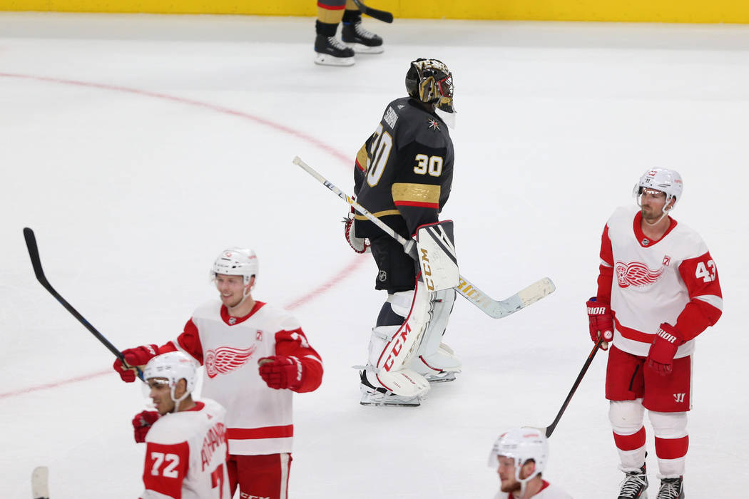 Vegas Golden Knights goaltender Malcolm Subban (30) leaves the ice as Detroit Red Wings celebrates their winning goal during overtime of an NHL hockey game at T-Mobile Arena in Las Vegas, Saturday ...