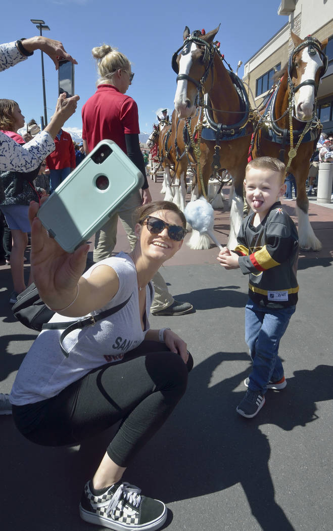 Kristy Pewitt takes a picture with her son Grayson, 3, during a visit by the Budweiser Clydesdales to the Smith’s Marketplace at 9710 W. Skye Canyon Park Drive in Las Vegas on Saturday, Mar ...