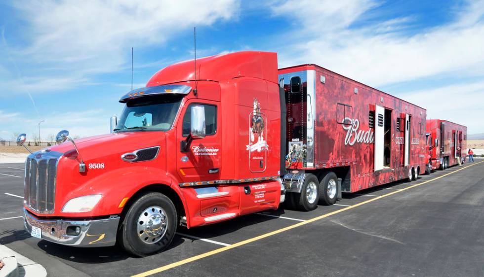 Trucks and horse trailers are shown during a visit by the Budweiser Clydesdales to the Smith’s Marketplace at 9710 W. Skye Canyon Park Drive in Las Vegas on Saturday, March 23, 2019. (Bill ...