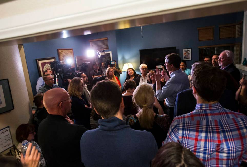 Democratic presidential candidate and former Texas congressman Beto O'Rourke, right, addresses a gathering during a campaign stop at a home in the Summerlin area of Las Vegas on Saturday, March 23 ...