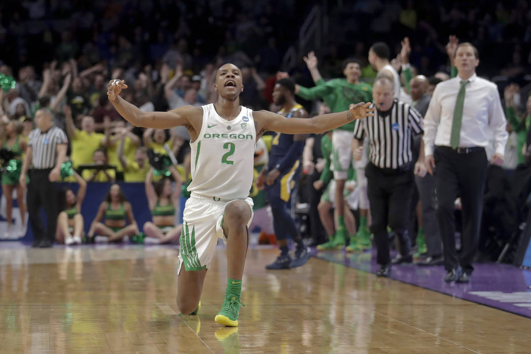 Oregon forward Louis King celebrates after scoring against UC Irvine during the second half of a second-round game in the NCAA men's college basketball tournament Sunday, March 24, 2019, in San Jo ...