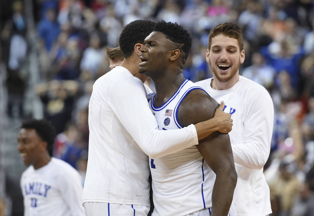 Duke's Zion Williamson, center, celebrates the team's 77-76 win over Central Florida in a second-round men's college basketball game in the NCAA Tournament in Columbia, S.C., Sunday, March 24, 201 ...