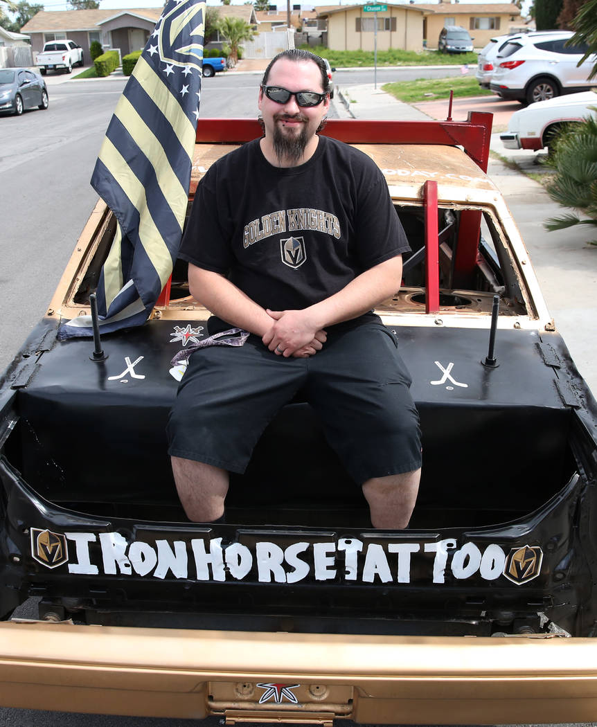 Andrew Carmean, a demolition driver, poses for a photo on his 1988 Lincoln Town Car on Tuesday, ...
