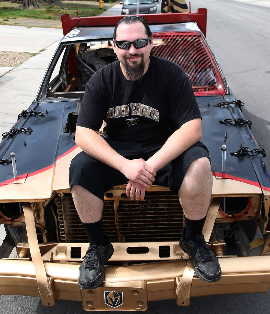 Andrew Carmean, a demolition driver, poses for a photo on his 1988 Lincoln Town Car on Tuesday, ...