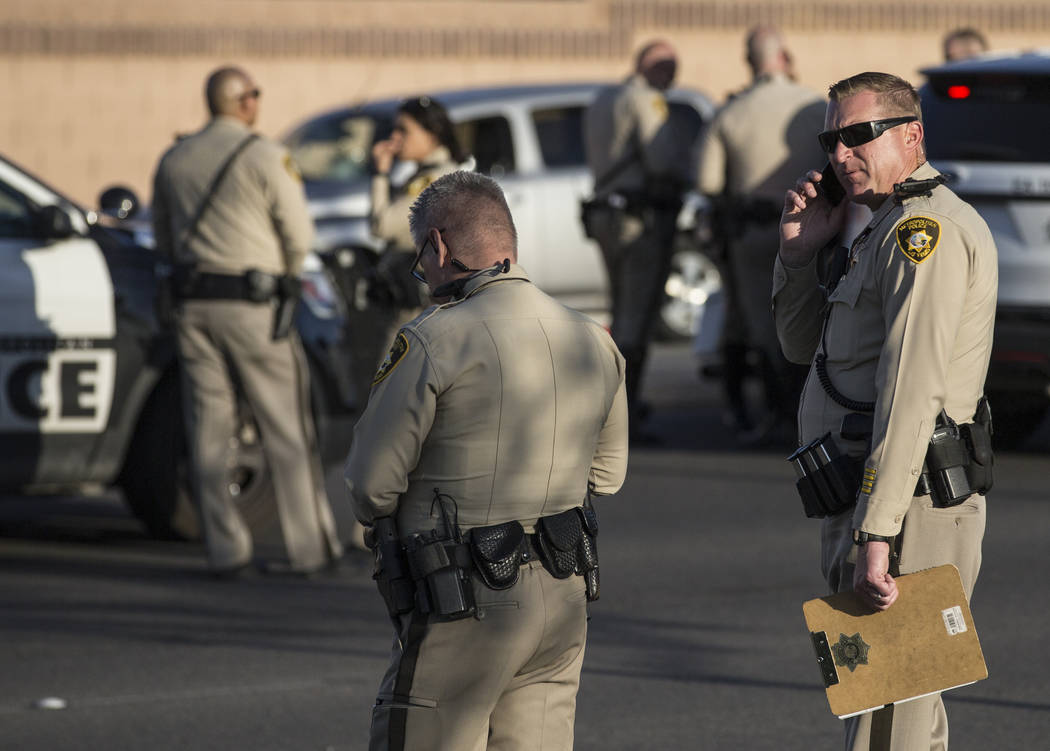 Law enforcement investigate a car accident at South Fort Apache Road and West Arby Avenue that left one minor dead and one hospitalized on Monday, March 25, 2019, in Las Vegas. (Benjamin Hager Rev ...