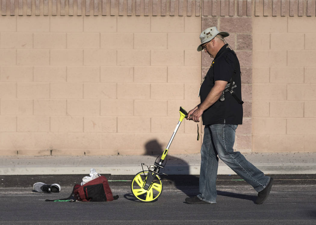 Law enforcement investigate a car accident at South Fort Apache Road and West Arby Avenue that left one minor dead and one hospitalized on Monday, March 25, 2019, in Las Vegas. (Benjamin Hager Rev ...