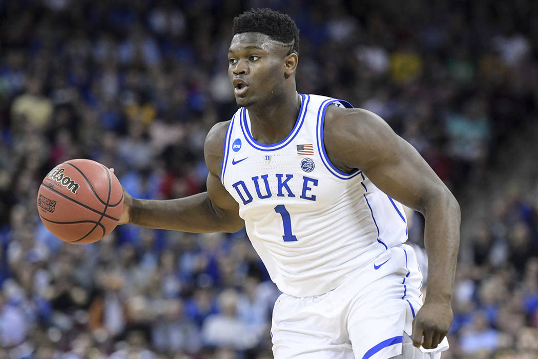 Duke forward Zion Williamson (1) dribbles the ball during the first half of a second-round game in the NCAA men's college basketball tournament Sunday, March 24, 2019, in Columbia, S.C. Duke defea ...