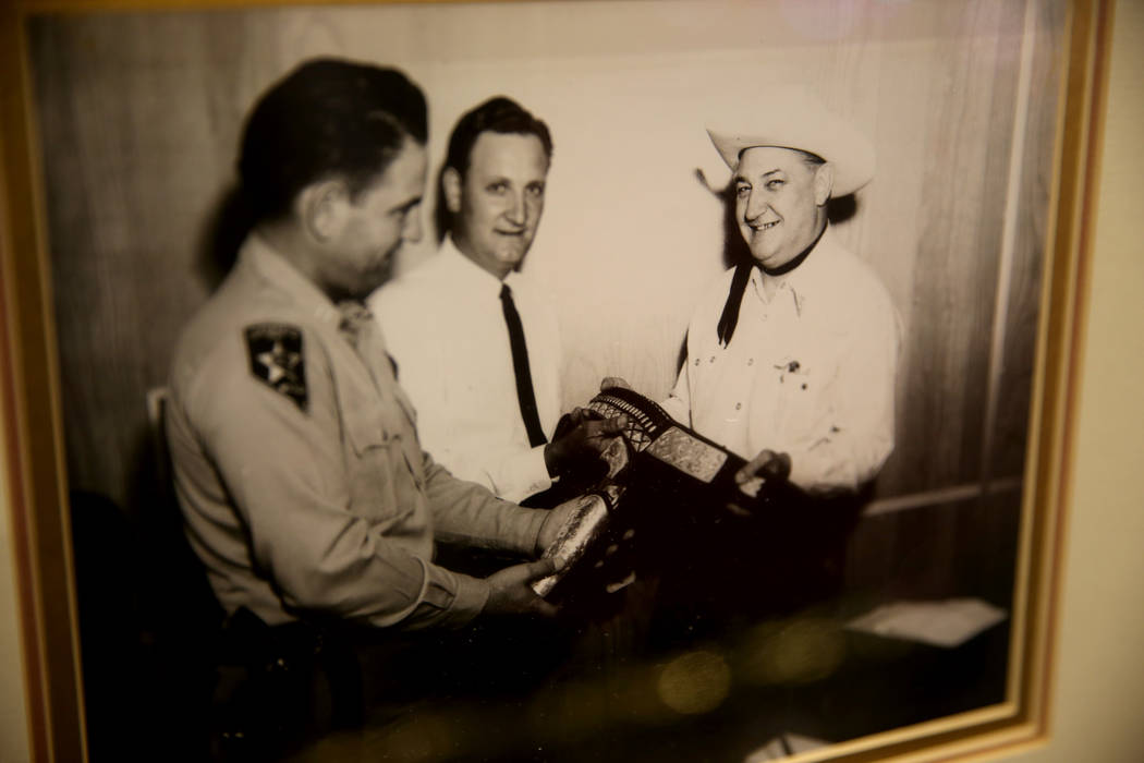 A photo of Boyd Gaming founder Sam Boyd, right, receiving a ceremonial pistol with Sheriff Ralp ...