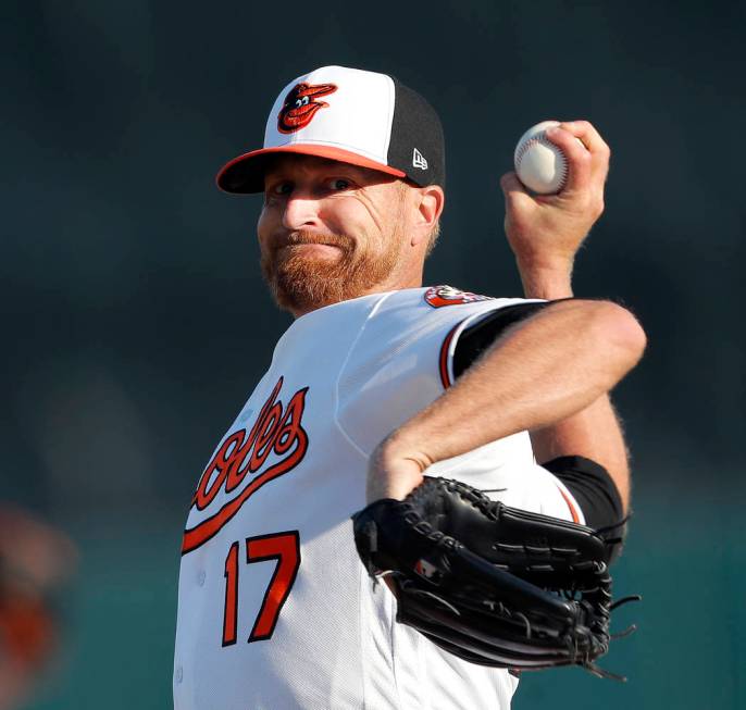 Baltimore Orioles starting pitcher Alex Cobb (17) warms up before facing Minnesota Twins in a spring training baseball game Saturday, March 23, 2019, in Sarasota, Fla. (AP Photo/John Bazemore)