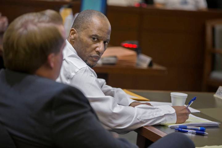 Defendant Leonard Woods, right, consults with his counsel during closing arguments on Monday, March 25, 2019, at the Regional Justice Center, in Las Vegas. Woods is charged with the fatal stabbing ...