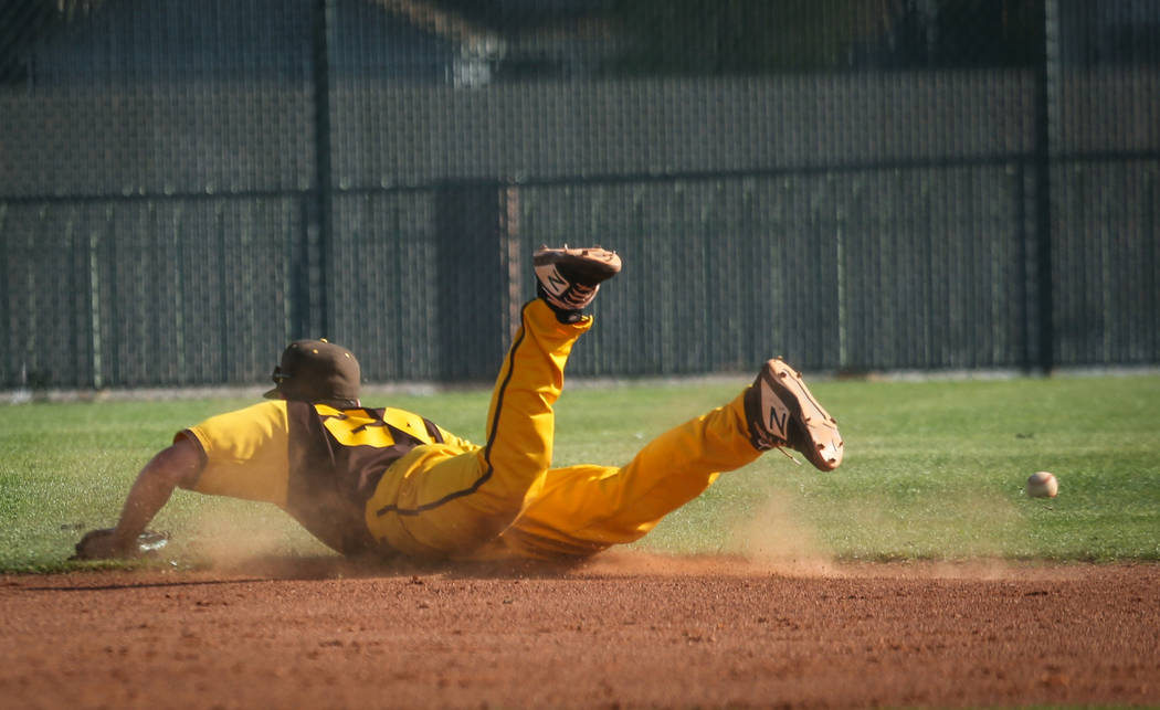 Bonanza shortstop Yankiel Gonzalez (24) misses a ground ball during a baseball game against Cimarron-Memorial High School at Bonanza High School in Las Vegas, Tuesday, March 26, 2019. (Caroline Br ...