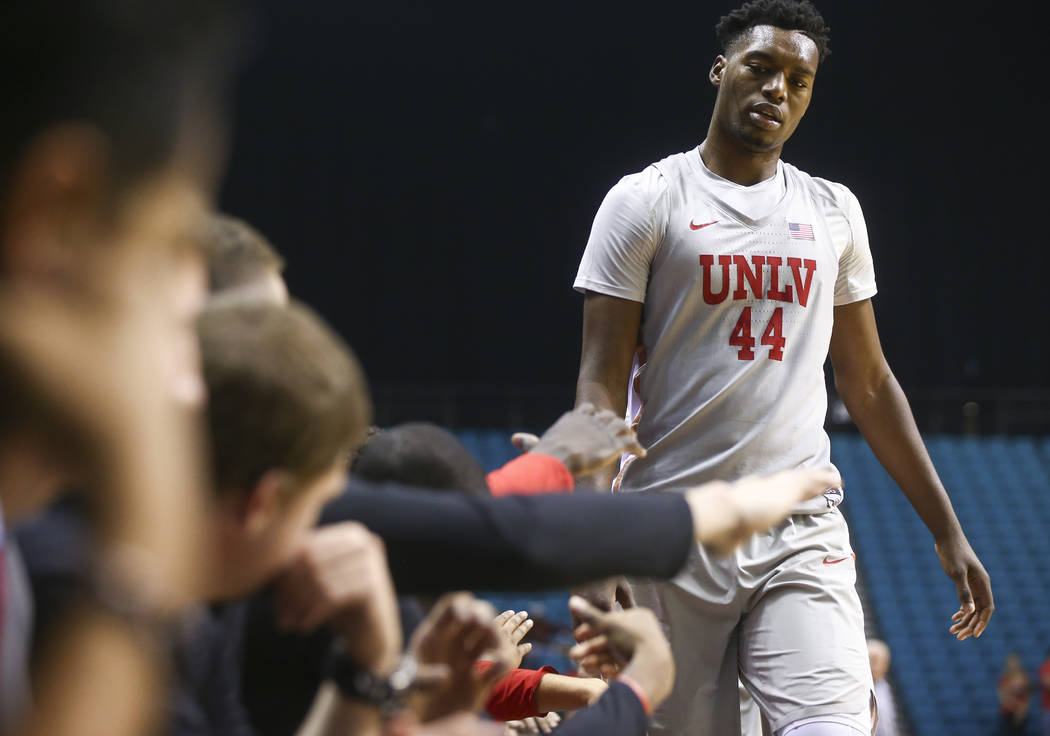 UNLV's Brandon McCoy (44) gets high-fives on his way back to the bench during his team's basketball game against Oral Roberts at the MGM Grand Garden Arena in Las Vegas on Tuesday, Dec. 5, 2017. U ...