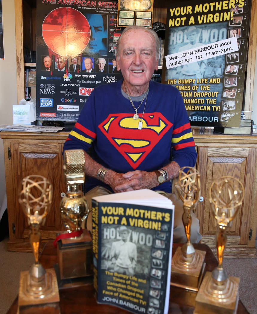 John Barbour, an actor, comedian, television host, poses for a photo with his three of five Emm ...