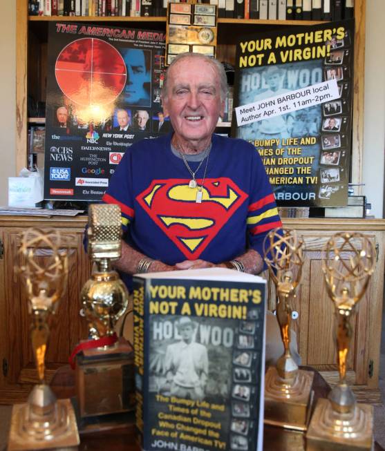 John Barbour, an actor, comedian, television host, poses for a photo with his three of five Emm ...