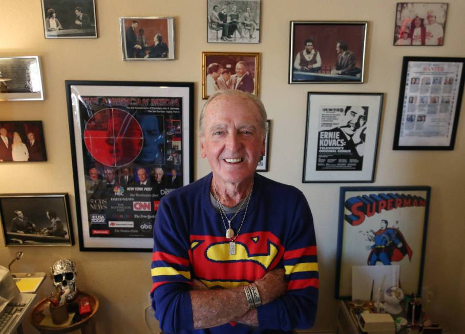 John Barbour, an actor, comedian, television host, poses for a photo in front of his memorabili ...