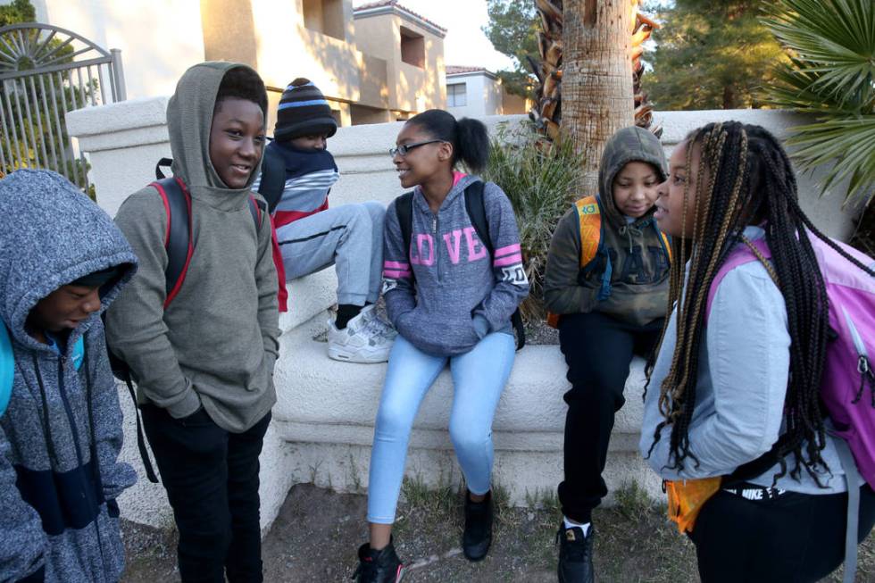 Students, from left, Taejon Brown, 11, Nicholas Jackson, 12, Detrik Gordon, 14, Ariana Patterso ...