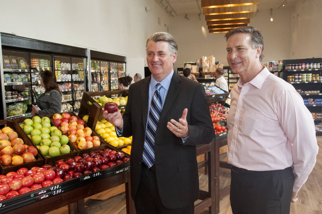 Patrick Parker, Raintree Investment Corp. president, left, and Doug McPhail, Seasons grocery st ...