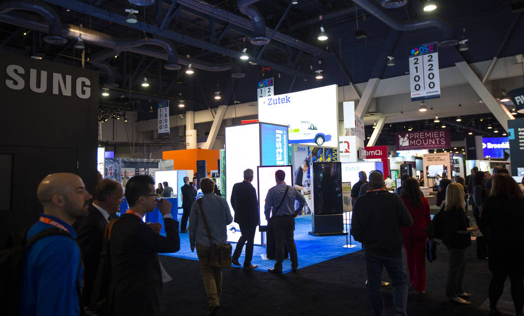 Attendees explore the show floor at the Digital Signage Expo at the Las Vegas Convention Center ...