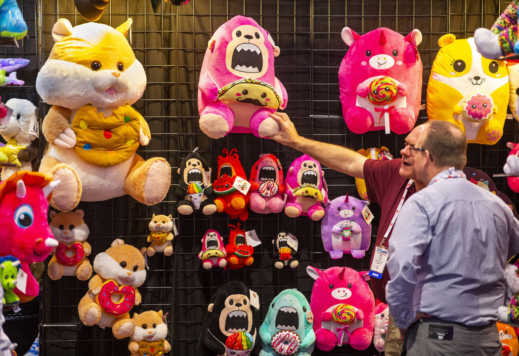 Bob Souza with Peek-A-Boo Toys shows off his stuffed animals during the Amusement Expo at the L ...
