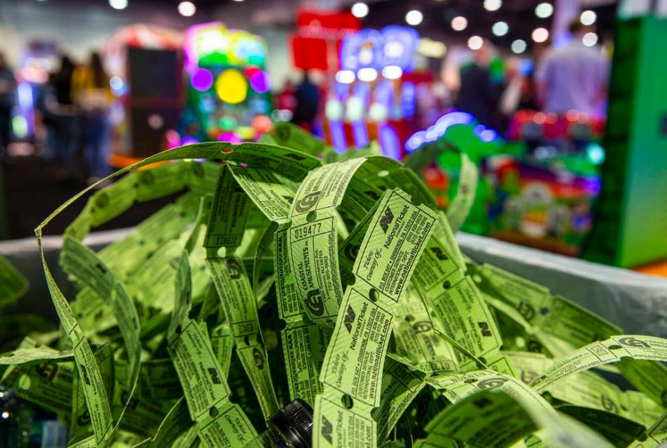 A pile of spent game tickets fills a trash can during the Amusement Expo at the Las Vegas Conve ...