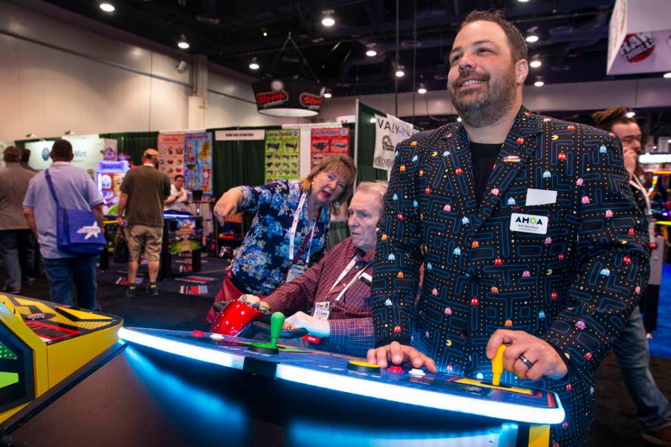 Bob Burnham with Paradise Pinball and Amusement LLC wears his Pacman suit while playing a giant ...