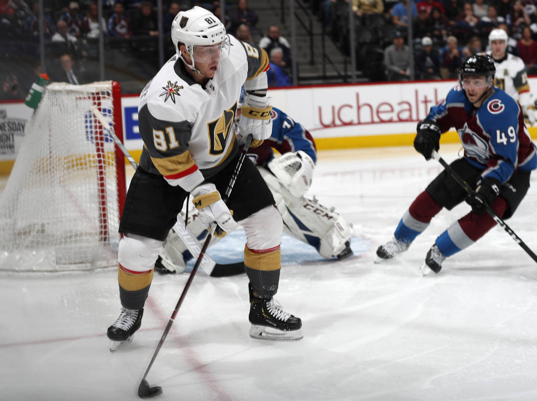 Vegas Golden Knights center Jonathan Marchessault looks to pass the puck as Colorado Avalanche ...