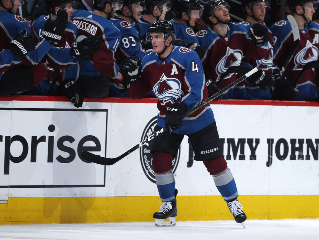 Colorado Avalanche defenseman Tyson Barrie, front, is congratulated for his goal against the Ve ...