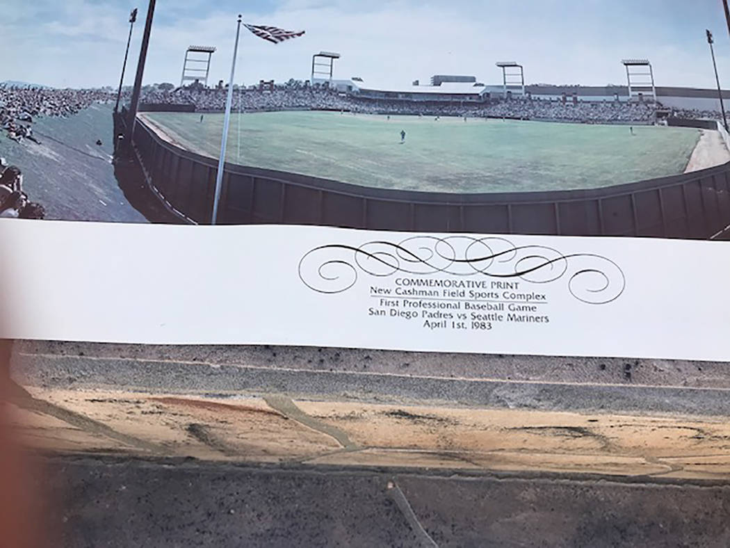 The commemorative print given to fans at the first baseball game in Cashman Field is seen up cl ...