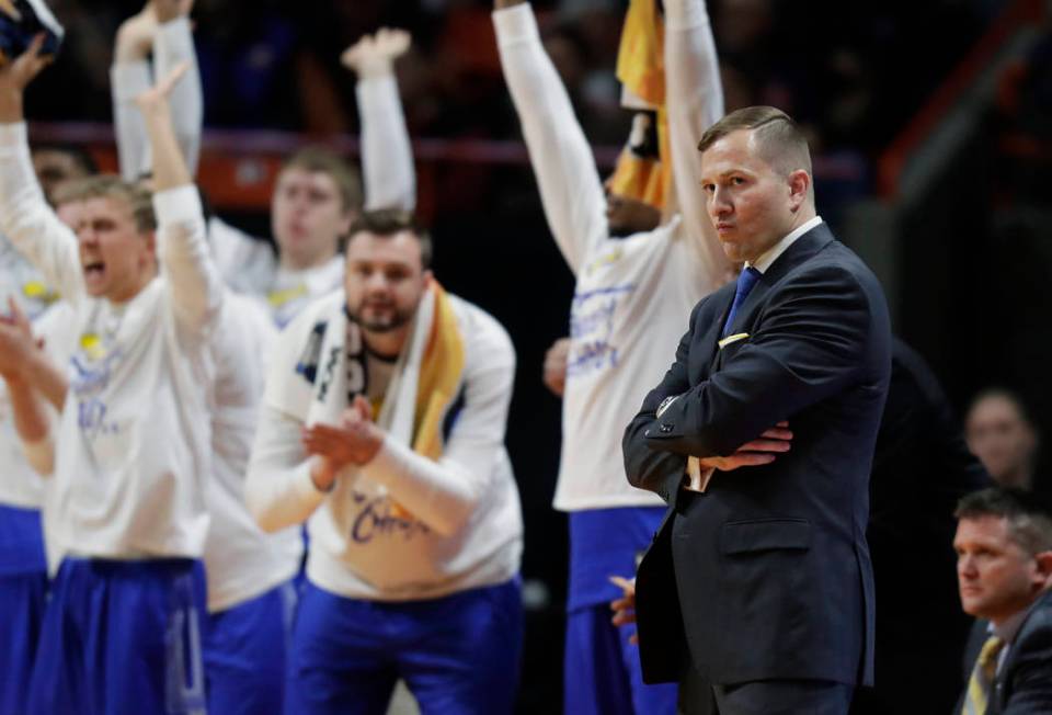 South Dakota State head coach T.J. Otzelberger, front right, watches from the bench during the ...