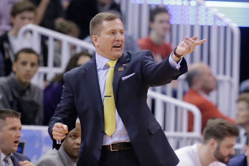 South Dakota State head coach T.J. Otzelberger shouts to his team during the first half of a fi ...