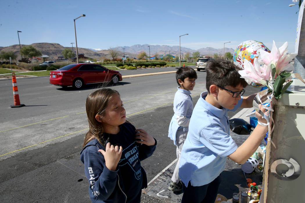 Evelyn Yoshimori, 7, from left, and her brothers, Leo, 9, and Talan, 11, visit a memorial on So ...