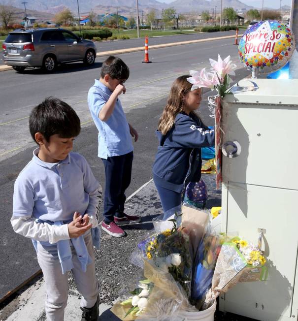Leo Yoshimori, 9, from left, and his siblings, Talan, 11, and Evelyn, 7, visit a memorial on So ...
