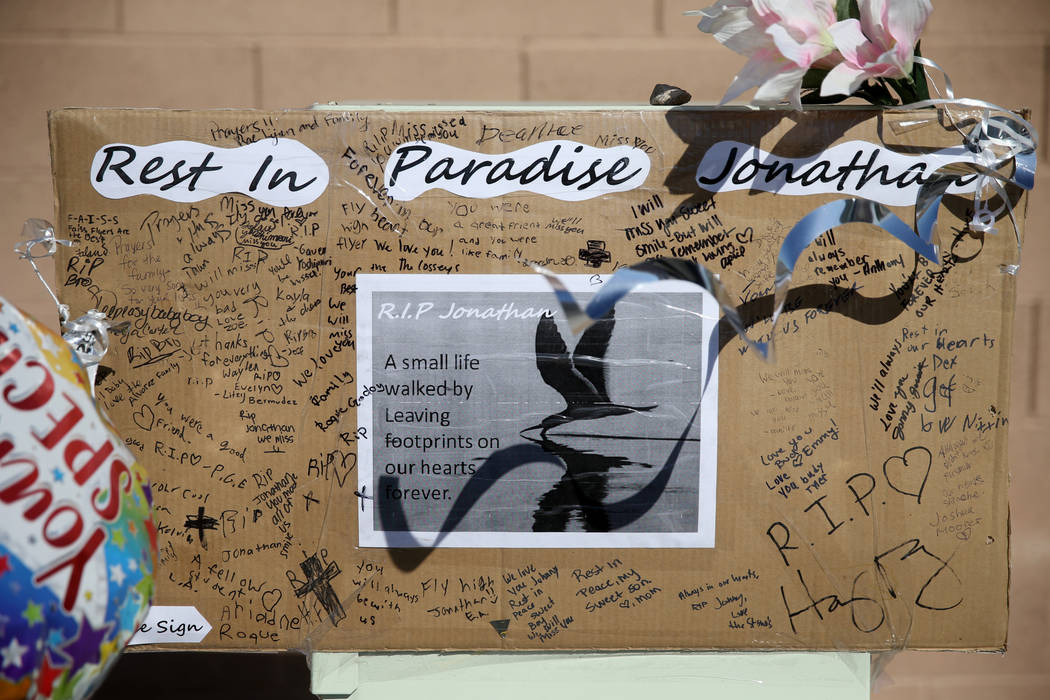 A memorial at the intersection of South Fort Apache Road and West Arby Avenue at at Faiss Park ...