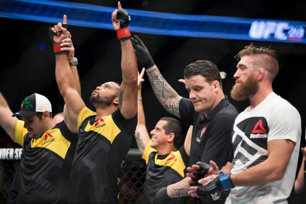 Thiago Santos, left, is announced the winner against Gerald Meerschaert in the UFC 213 middlewe ...