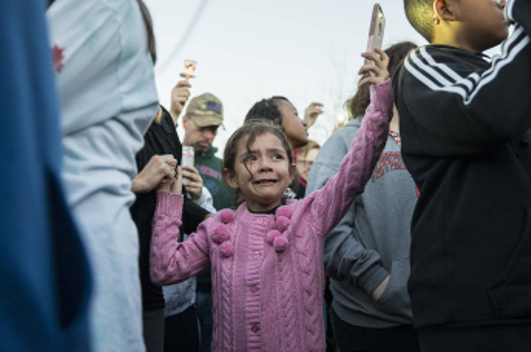 Friends and family mourn the loss of Jonathan Smith, 12, during a vigil for Smith at Wilbur & T ...