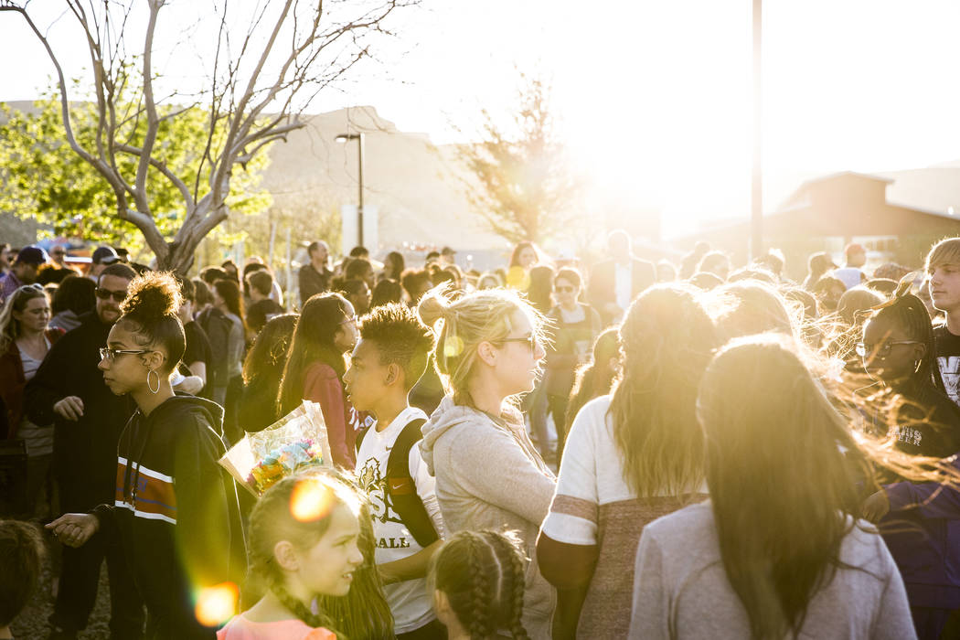 Friends and family gather to mourn the loss of Jonathan Smith, 12, during a vigil for Smith at ...