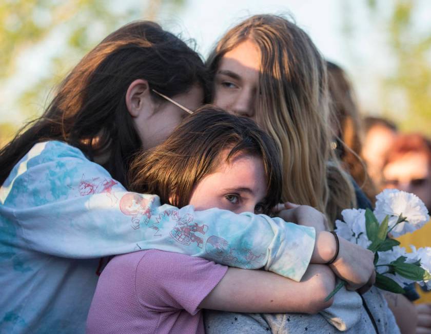 Friends and family mourn the loss of Jonathan Smith, 12, during a vigil for Smith at Wilbur &am ...