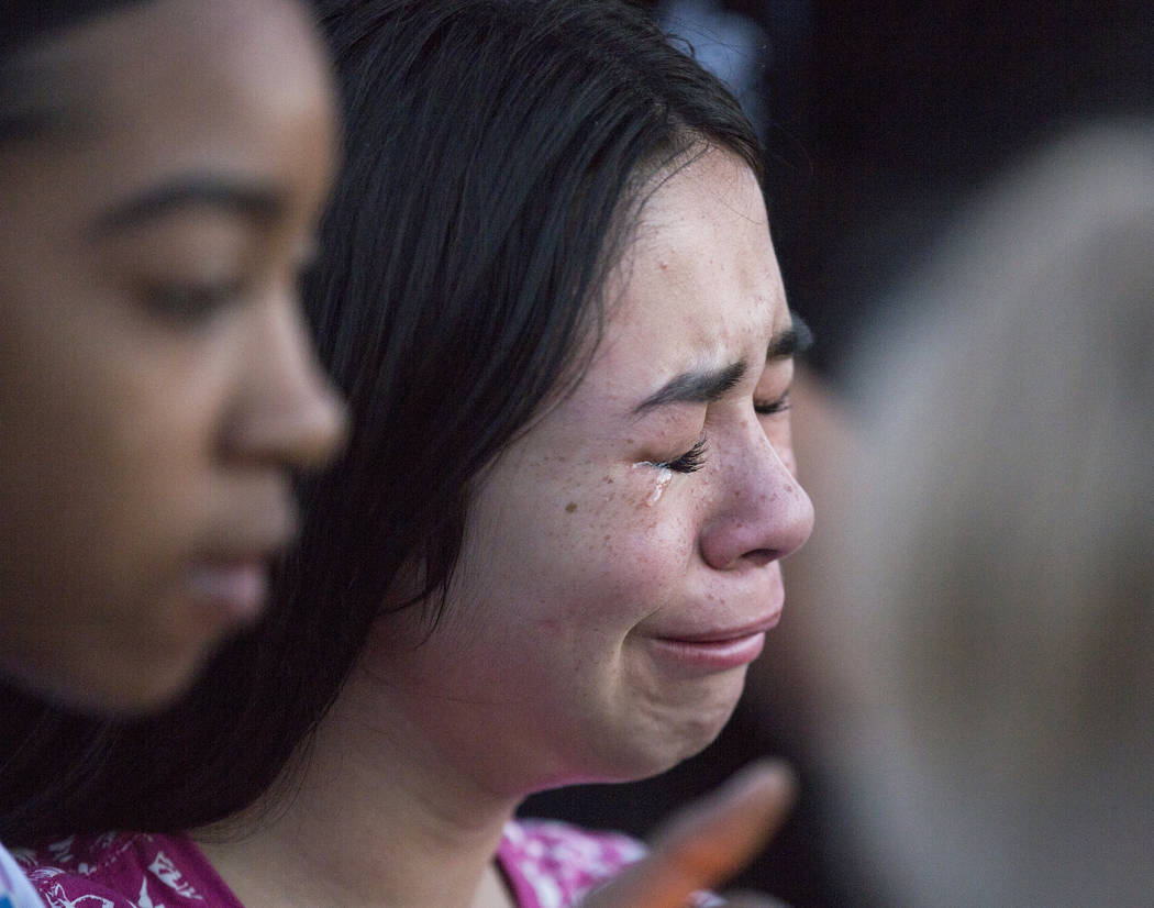 Friends and family mourn the loss of Jonathan Smith, 12, during a vigil for Smith at Wilbur &am ...