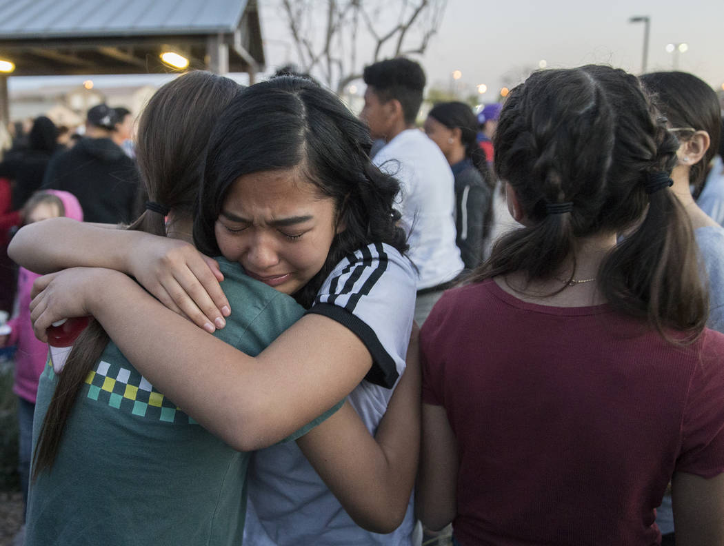 Friends and family mourn the loss of Jonathan Smith, 12, during a vigil for Smith at Wilbur &am ...